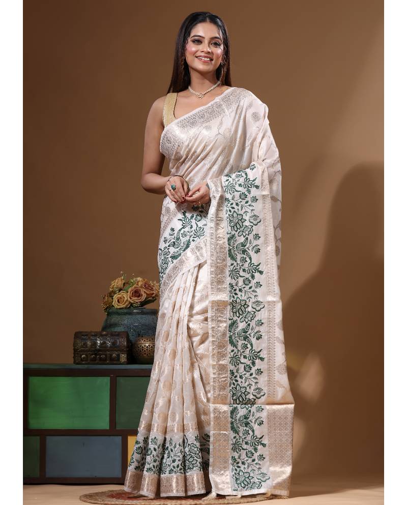 Off-white banarasi silk (jacquard) with computer embroidery saree with blouse piece
