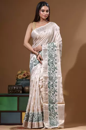 Off-white banarasi silk (jacquard) with computer embroidery saree with blouse piece
