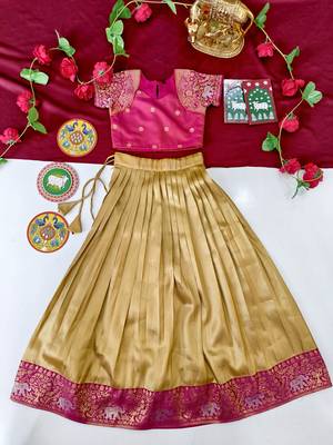 Gold silk tissue skirt paired with a soft silk top, adorned with a contrast pink border 2