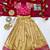 Gold silk tissue skirt paired with a soft silk top, adorned with a contrast pink border