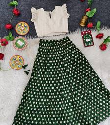 Girls traditional green polka dot lehenga choli in silk blend with v-neck