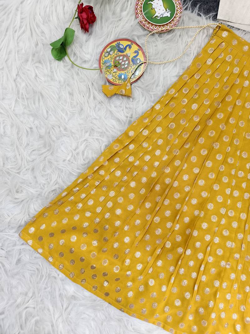 Girls traditional yellow polka dot lehenga choli in silk blend with v-neck