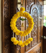 Handmade Artificial Genda Flower Ring Hanging with Parrot and Bell Decoration for Home Decor (Pack of 2)