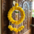 Handmade Artificial Genda Flower Ring Hanging with Parrot and Bell Decoration for Home Decor (Pack of 2)