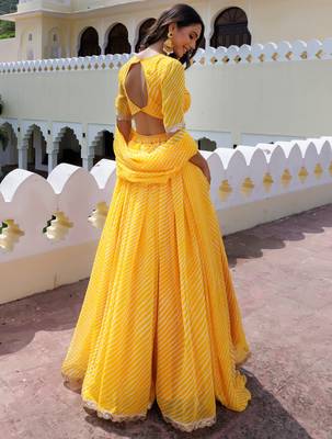 Enchanting Yellow Laheriya Printed Haldi Wear Lehenga Choli With Dupatta 2