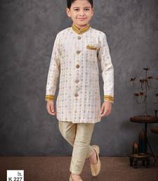 Off white jacket attached indo-western  set with computer stone work, lace & fancy buttons