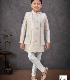 Cream jacket-attached indo-western set with stone work, lace & fancy buttons