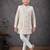 Cream jacket-attached indo-western set with stone work, lace & fancy buttons