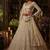 Beige net heavily embroidered bridal reception lehenga choli set