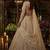 Beige net heavily embroidered bridal reception lehenga choli set