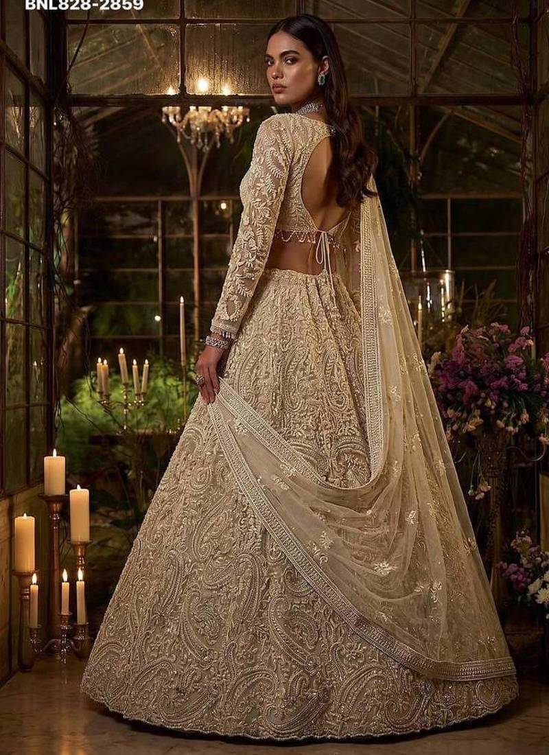 Beige net heavily embroidered bridal reception lehenga choli set