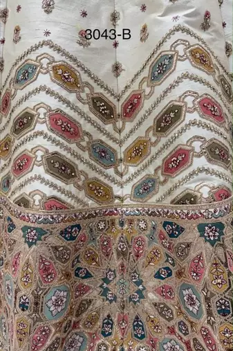 Off-white silk blend embroidered designer reception lehenga choli set