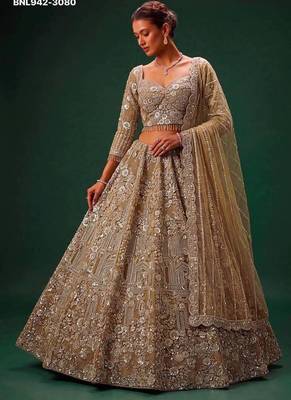Beige net heavily embroidered royal bridal reception lehenga choli set 1