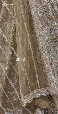 Beige net heavily embroidered royal bridal reception lehenga choli set 3