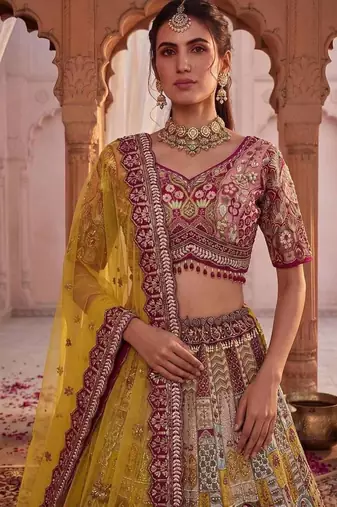 Off-white silk blend embroidered multi-color bridal lehenga choli set