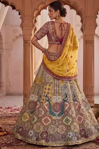 Off-white silk blend embroidered multi-color bridal lehenga choli set