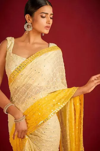 Yellow elegant designer heavy embroidered sequin georgette saree