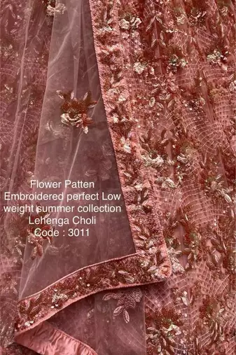 Pink net embroidered lehenga choli