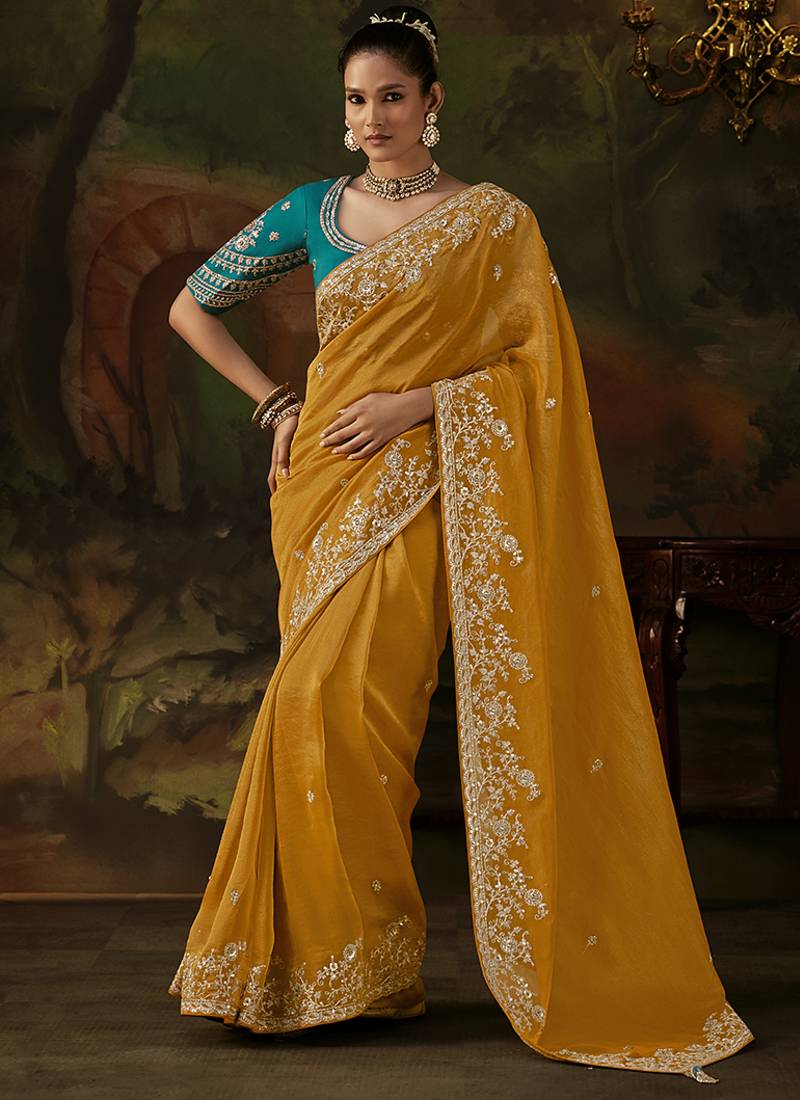 mustard yellow faux tissue saree with contrast embroidered blouse