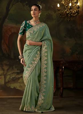 pista green faux tissue saree with contrast embroidered blouse 1