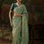 pista green faux tissue saree with contrast embroidered blouse