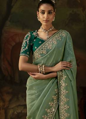 pista green faux tissue saree with contrast embroidered blouse 2