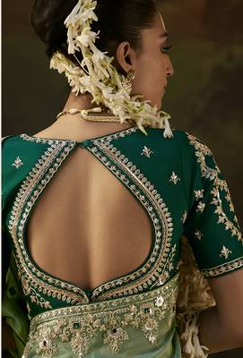 pista green faux tissue saree with contrast embroidered blouse 3