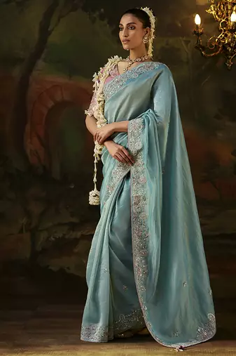 sky blue faux tissue saree with contrast embroidered blouse