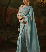 sky blue faux tissue saree with contrast embroidered blouse