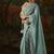 sky blue faux tissue saree with contrast embroidered blouse