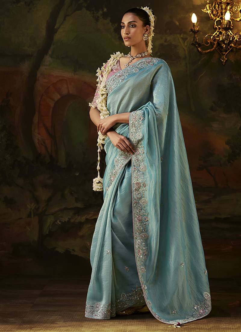sky blue faux tissue saree with contrast embroidered blouse