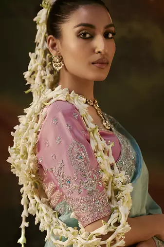 sky blue faux tissue saree with contrast embroidered blouse