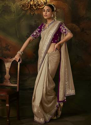 beige faux tissue saree with contrast embroidered blouse 1