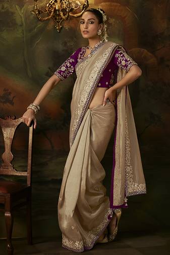 beige faux tissue saree with contrast embroidered blouse