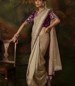 beige faux tissue saree with contrast embroidered blouse
