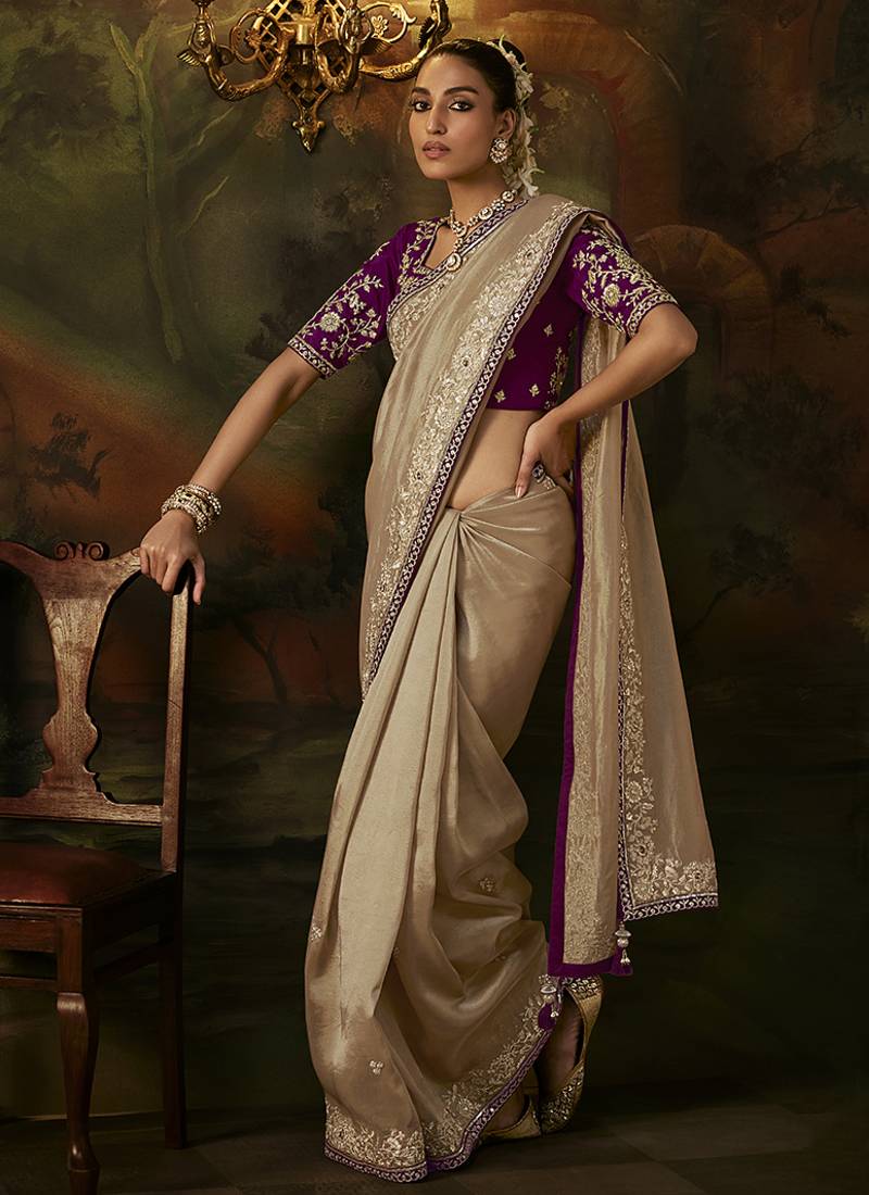 beige faux tissue saree with contrast embroidered blouse