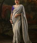 grey faux tissue saree with contrast embroidered blouse