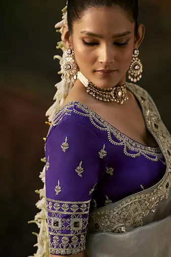 grey faux tissue saree with contrast embroidered blouse