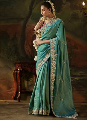 sea green faux tissue saree with contrast embroidered blouse 1