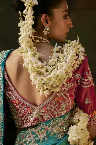 sea green faux tissue saree with contrast embroidered blouse