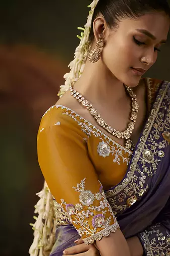 violet faux tissue saree with contrast embroidered blouse