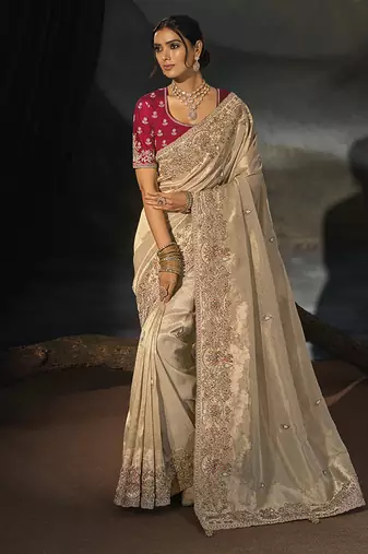 beige silk blend saree with floral zardozi border & magenta blouse