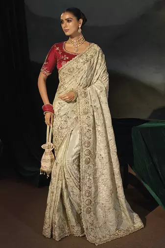 cream silk blend saree with zardozi border & red blouse