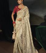 cream silk blend saree with zardozi border & red blouse