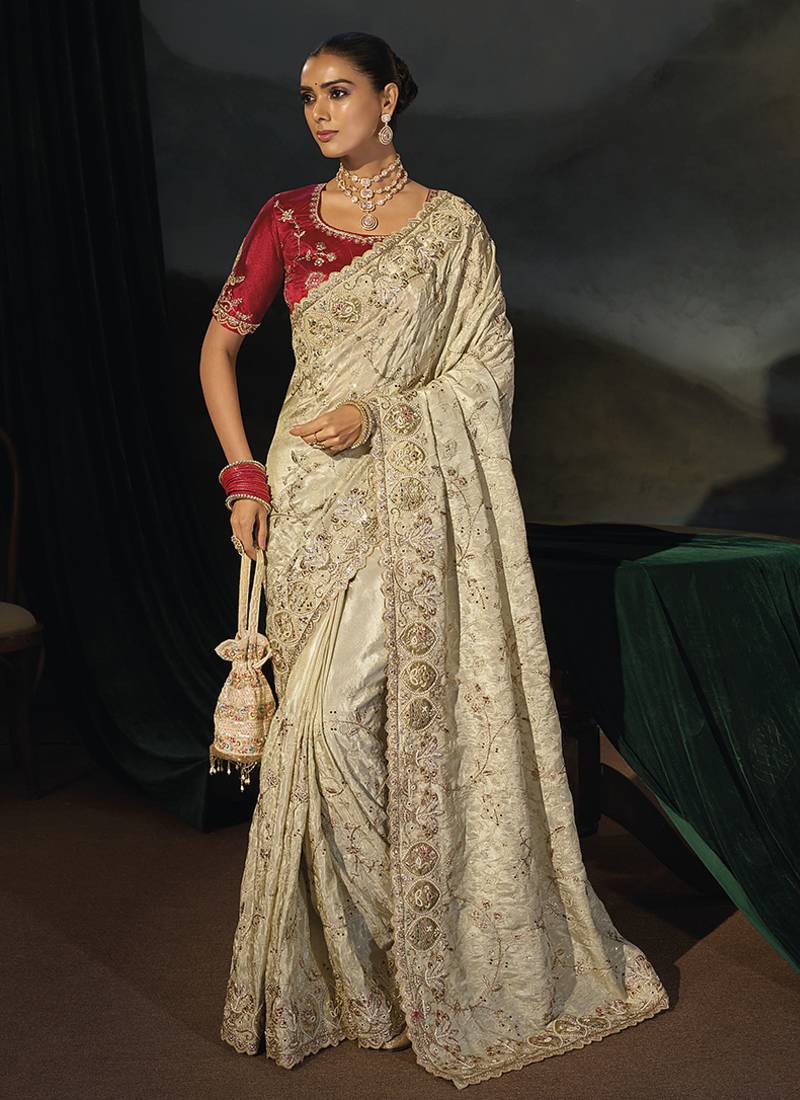 cream silk blend saree with zardozi border & red blouse