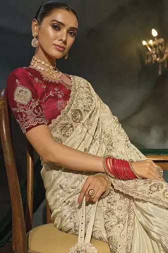 cream silk blend saree with zardozi border & red blouse