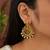 Gold plated lakshmi temple earrings with ruby green stones & pearl beads- green