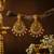 Gold plated lakshmi temple earrings with ruby green stones & pearl beads - red