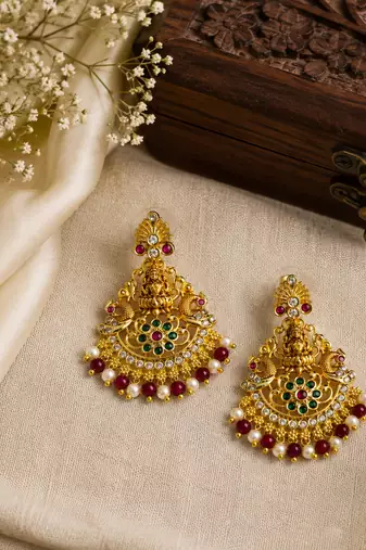 Gold plated lakshmi temple earrings with ruby green stones & pearl beads - red