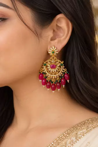 Traditional gold plated kundan chandbali earrings with red beads & green stones